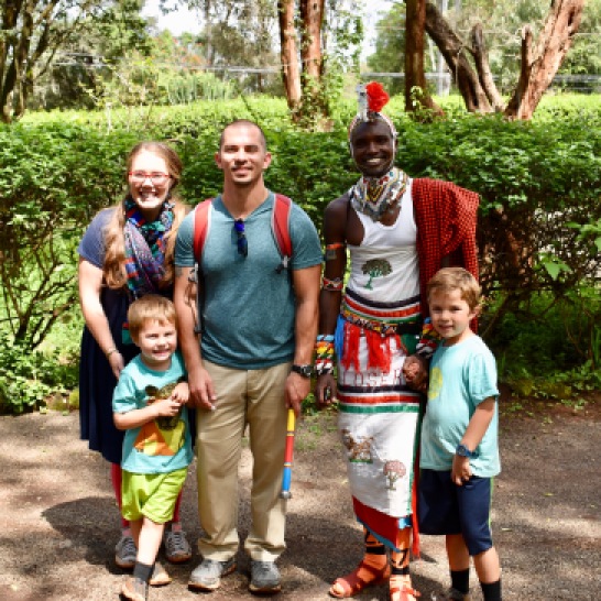 Standing with a man from the Maasai Tribe!